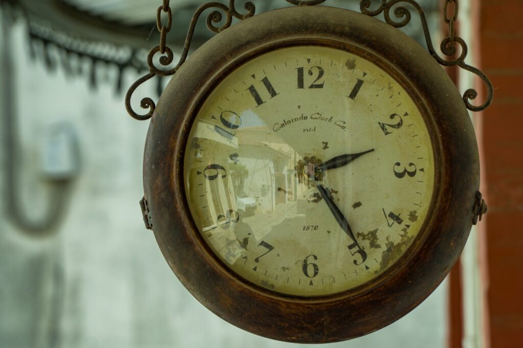 Rustic Colorado Clock Co. hanging timepiece exuding vintage appeal.